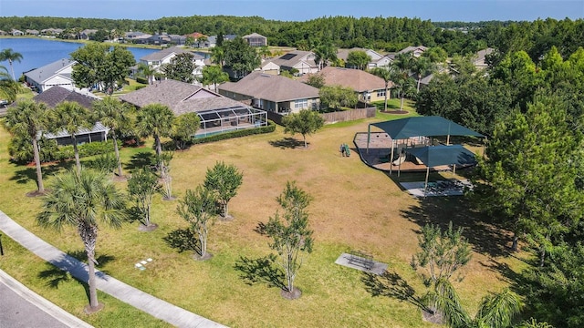 drone / aerial view with a residential view and a water view