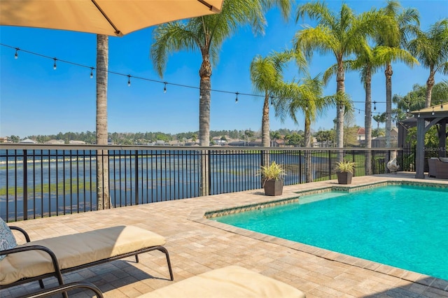 view of swimming pool featuring a fenced in pool, a patio, and fence