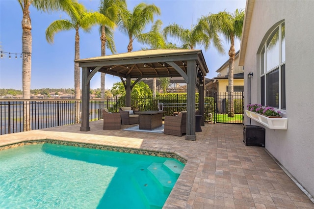 view of pool with a fenced in pool, a gazebo, an outdoor hangout area, a fenced backyard, and a patio