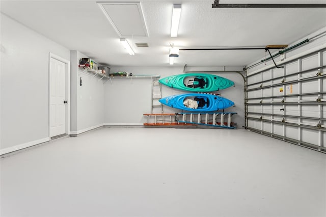 garage with visible vents and baseboards