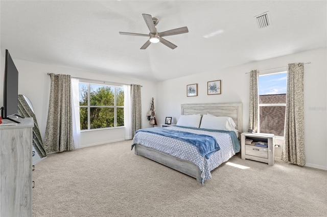 bedroom with baseboards, visible vents, a ceiling fan, and carpet