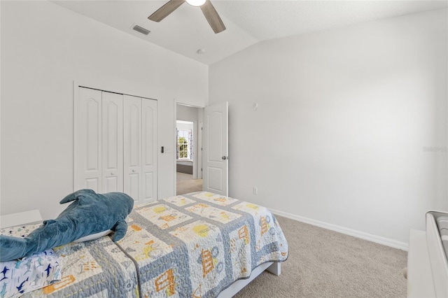 carpeted bedroom with visible vents, ceiling fan, baseboards, lofted ceiling, and a closet