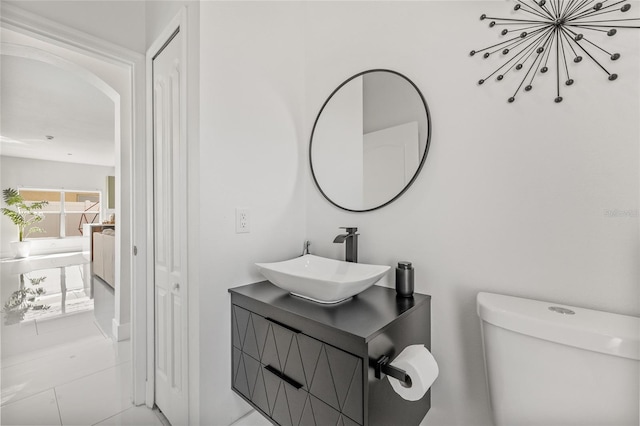 bathroom featuring toilet and vanity