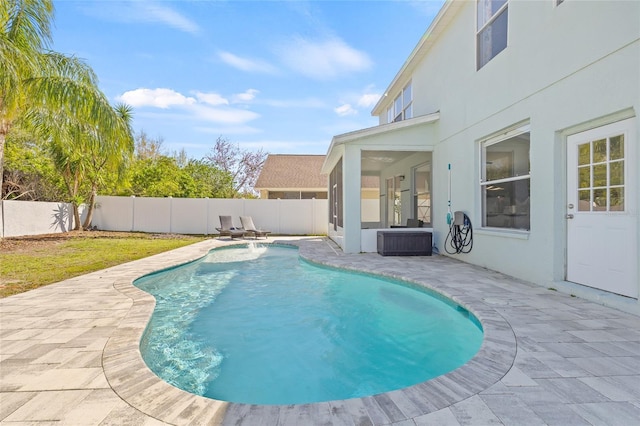 view of swimming pool with a patio area, a fenced in pool, and a fenced backyard