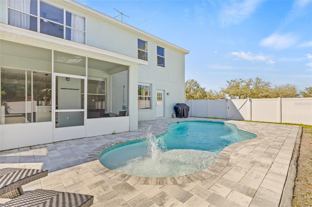 view of pool featuring grilling area, a fenced in pool, a fenced backyard, a patio, and a gate