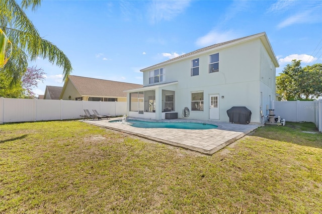 rear view of property featuring a patio, a fenced backyard, a yard, a sunroom, and a fenced in pool