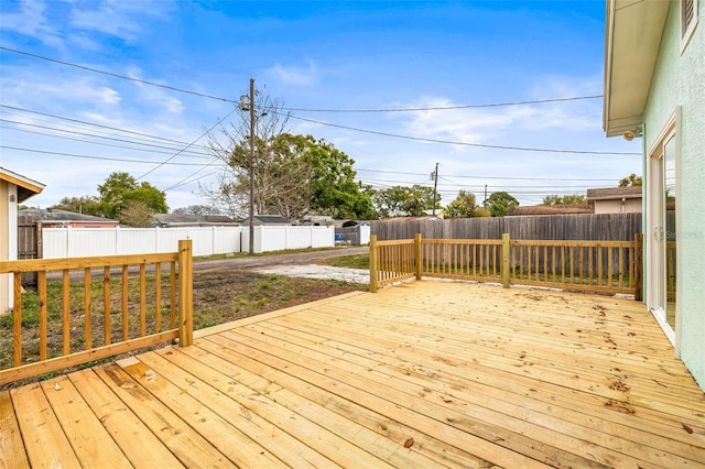 deck with a fenced backyard