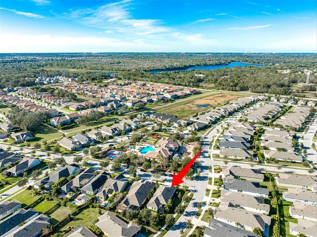 birds eye view of property featuring a residential view and a water view