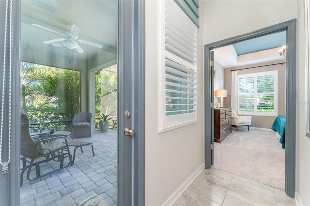 interior space with ceiling fan