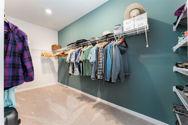 spacious closet with carpet floors