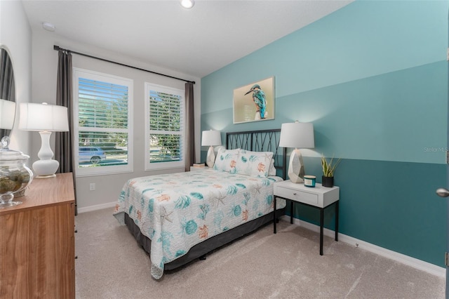 bedroom featuring baseboards and carpet floors