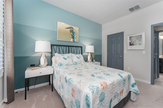 bedroom with visible vents, baseboards, and carpet