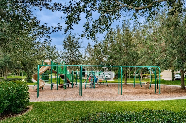 community playground featuring a lawn