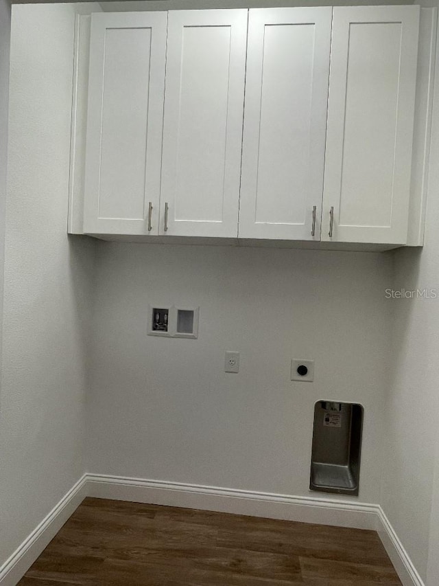 clothes washing area with hookup for a washing machine, cabinet space, dark wood-style flooring, and electric dryer hookup