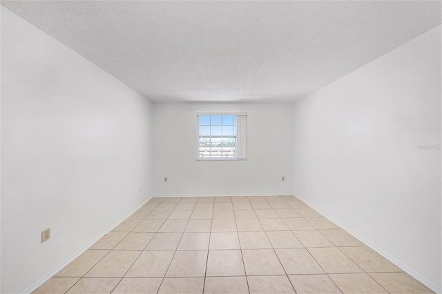 empty room with a textured ceiling