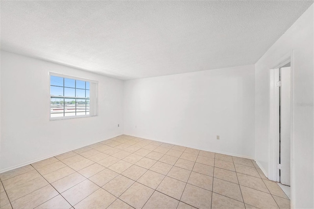 empty room featuring a textured ceiling