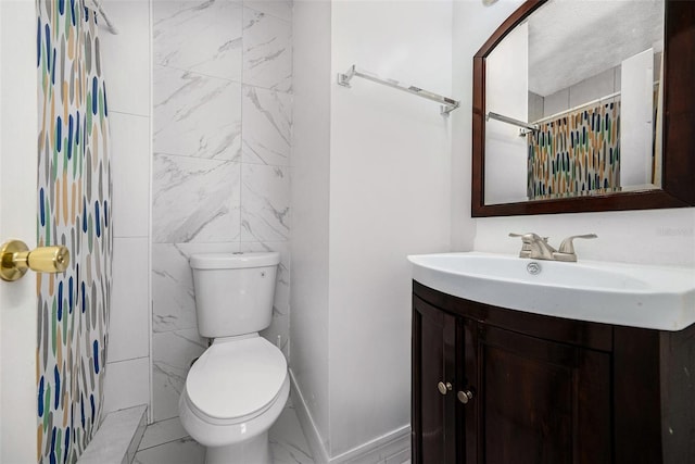 full bath featuring a shower with shower curtain, toilet, marble finish floor, and vanity