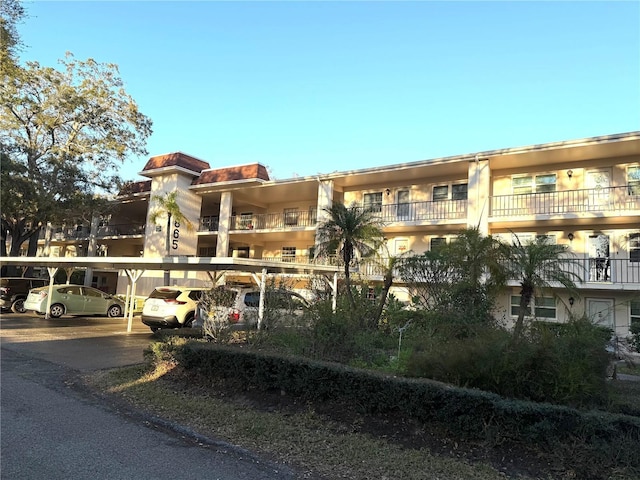 view of property featuring covered parking