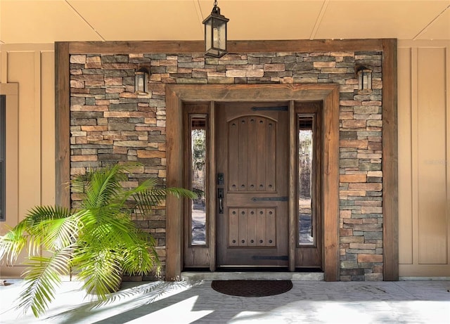 view of exterior entry with stone siding