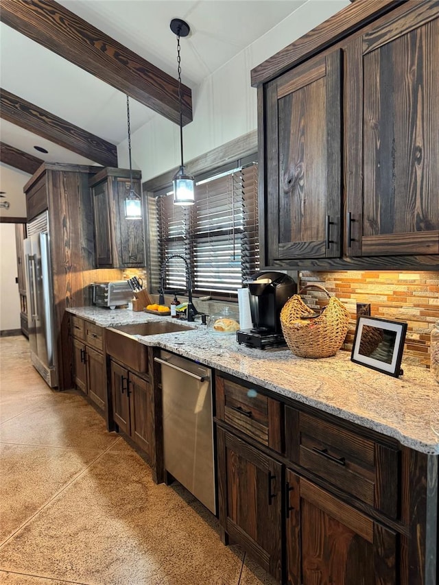 kitchen with a sink, stainless steel appliances, beam ceiling, and dark brown cabinets