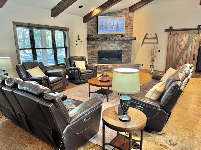 living area with a barn door, vaulted ceiling with beams, a fireplace, and baseboards