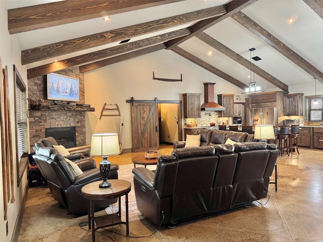 living room with a barn door, beamed ceiling, and high vaulted ceiling