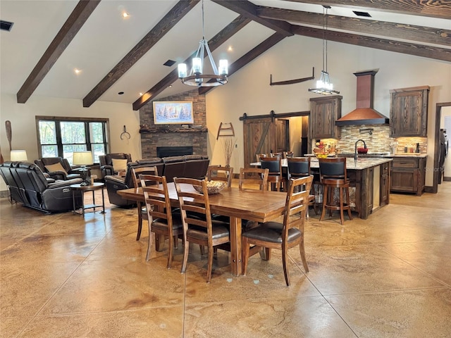 dining space with visible vents, high vaulted ceiling, a barn door, beamed ceiling, and a notable chandelier