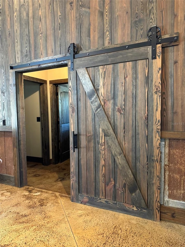 interior space featuring a barn door