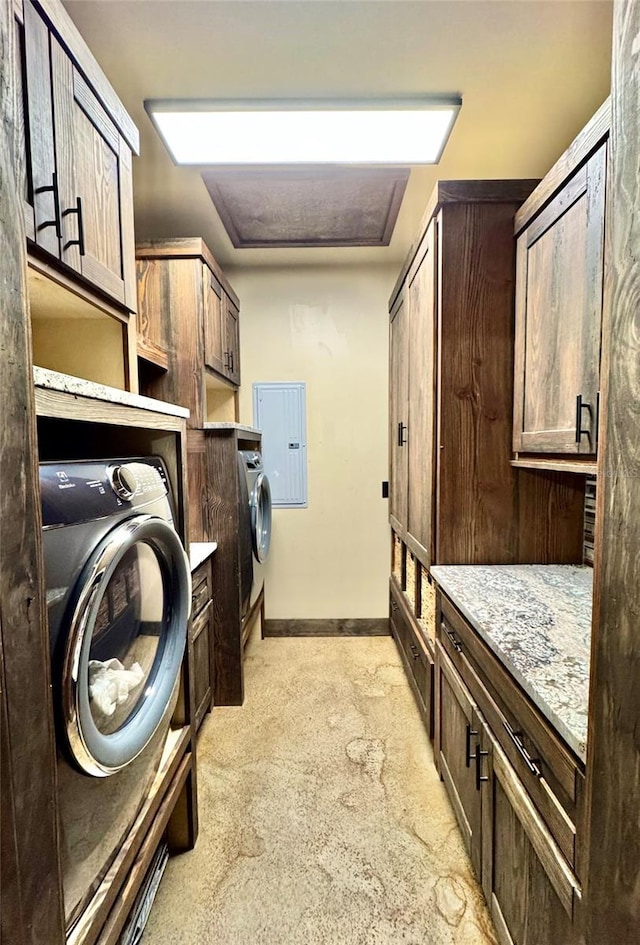 laundry room with cabinet space, washer / clothes dryer, and baseboards