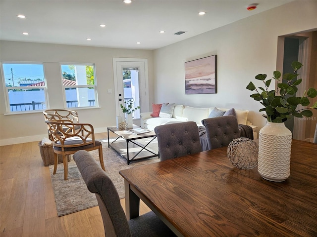 dining space with recessed lighting, visible vents, light wood finished floors, and baseboards