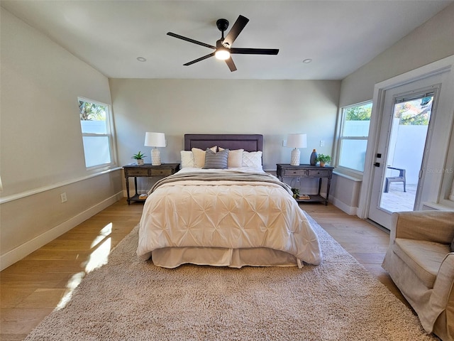 bedroom featuring light wood-style flooring, baseboards, access to exterior, and a ceiling fan