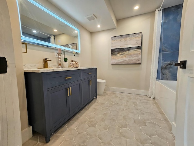 full bath with vanity, baseboards, visible vents, tile patterned floors, and toilet