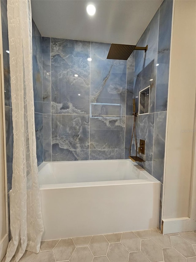 bathroom featuring tile patterned floors and shower / tub combo with curtain