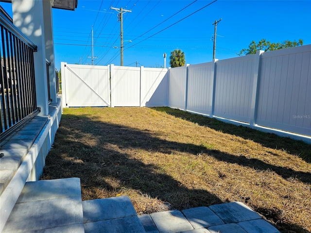 view of yard with a fenced backyard