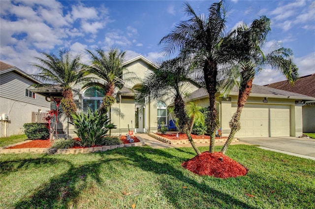 view of property hidden behind natural elements featuring a front lawn, a garage, driveway, and stucco siding