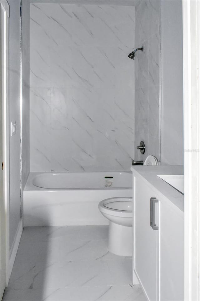 bathroom featuring shower / tub combination, marble finish floor, vanity, and toilet