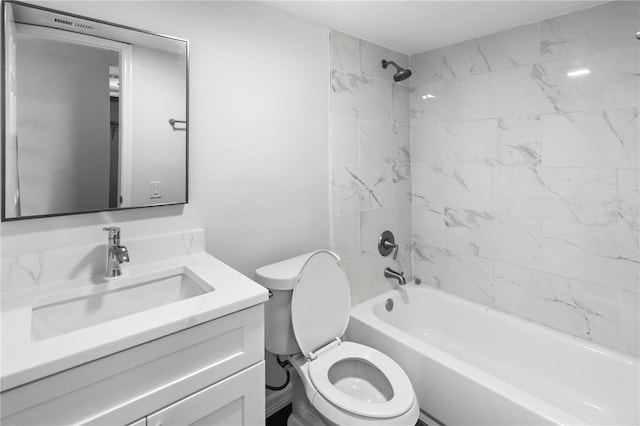 full bathroom featuring toilet, washtub / shower combination, and vanity