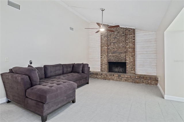 living area with visible vents, a brick fireplace, baseboards, and a ceiling fan