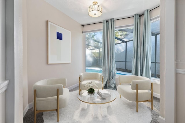 sitting room featuring baseboards