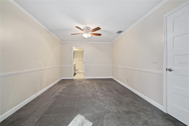 unfurnished room with visible vents, crown molding, baseboards, ceiling fan, and carpet floors