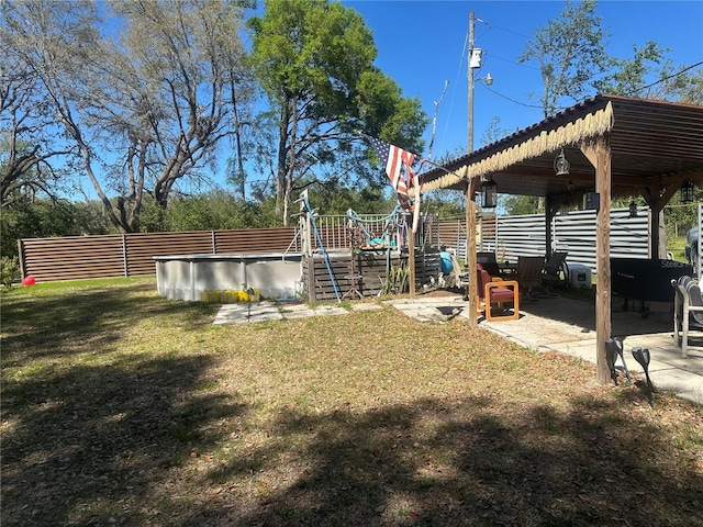 view of yard featuring a patio and fence