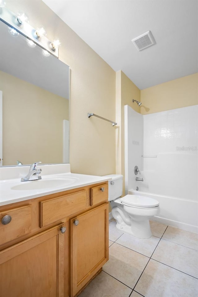 full bathroom featuring vanity, visible vents,  shower combination, tile patterned floors, and toilet