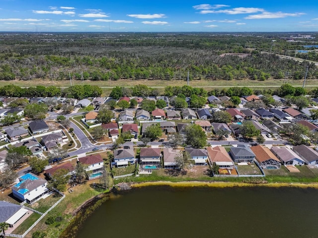 birds eye view of property with a residential view and a water view