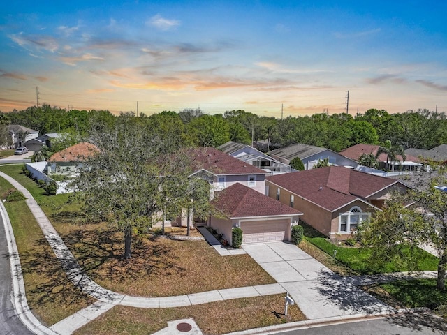 aerial view at dusk with a residential view