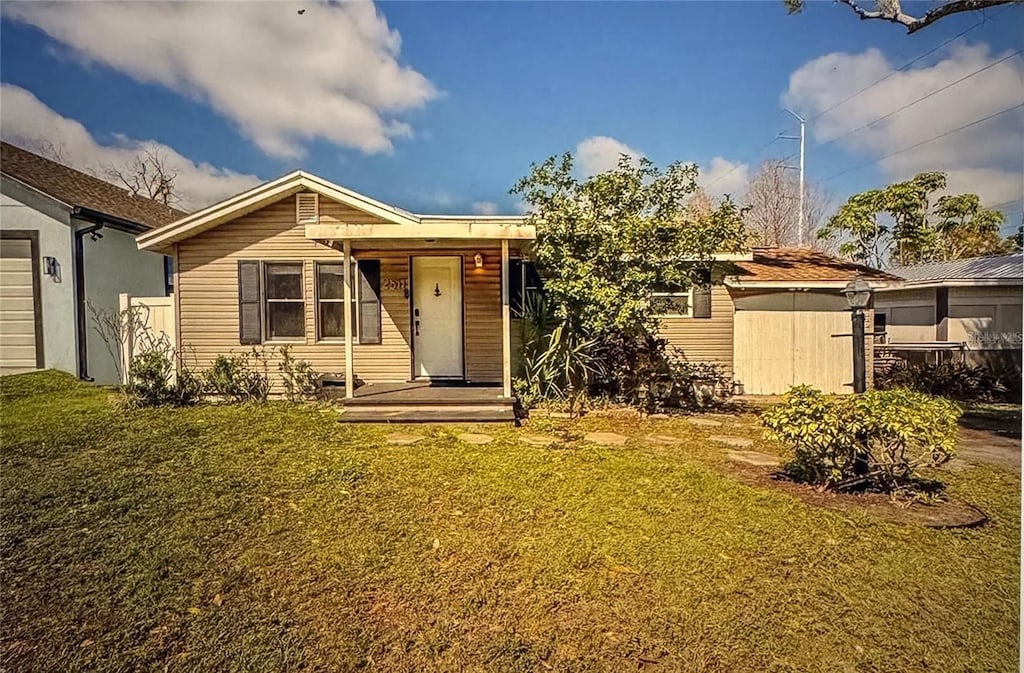 ranch-style house with a front lawn