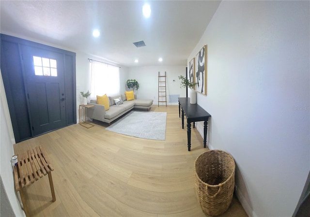 entryway with recessed lighting, light wood-style flooring, baseboards, and visible vents