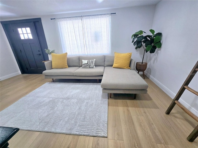 living area featuring wood finished floors and baseboards