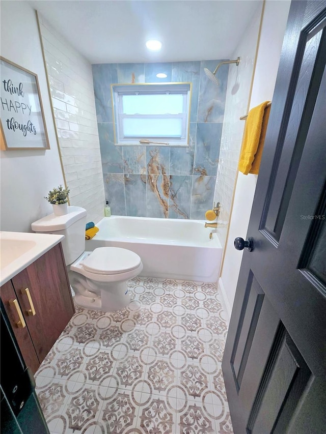 bathroom with tile patterned floors, vanity, toilet, and  shower combination