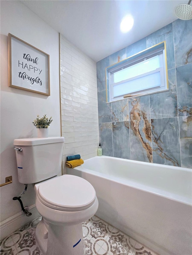 bathroom featuring tile patterned flooring, toilet, and baseboards