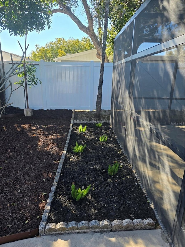 view of yard with an outbuilding and a fenced backyard